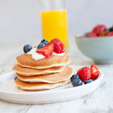 High protein pancakes - mixed berries and greek yoghurt with honey, fresh breakfast meal prep UK