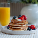 High protein pancakes - mixed berries and greek yoghurt with honey, fresh breakfast meal prep UK