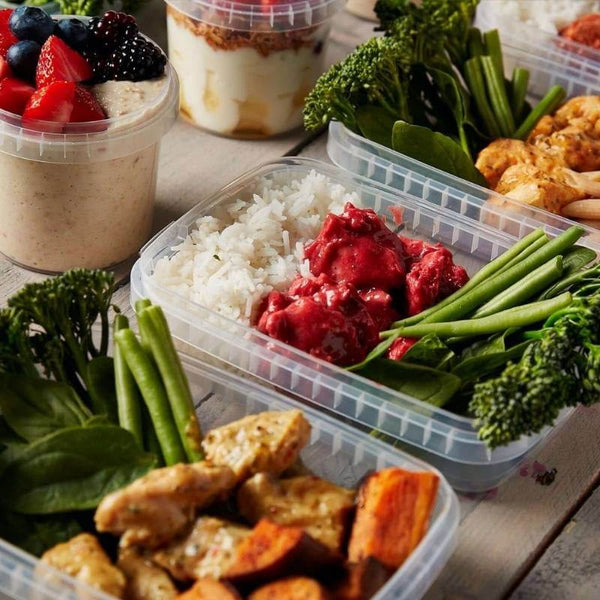 Macro Based Diet 1500 Calorie Meal Package with high-protein chicken, steamed vegetables, rice, and fresh yogurt parfait topped with berries, perfect for weight loss and healthy eating.