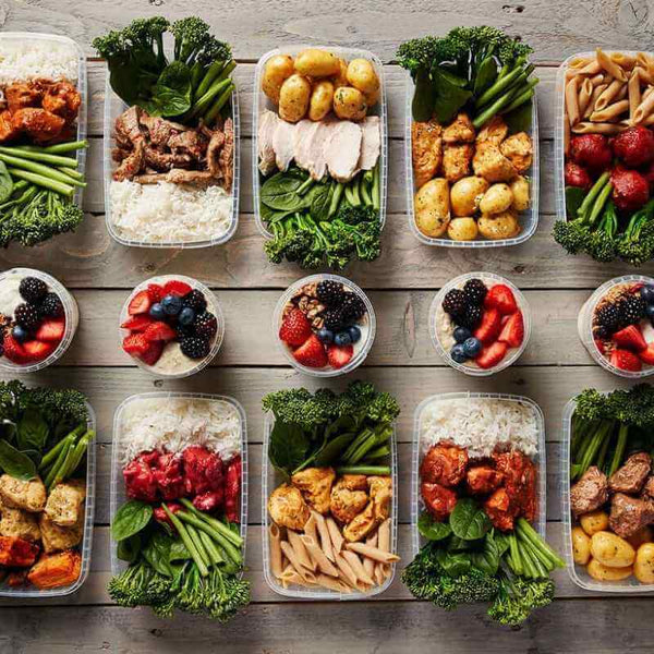 Macro Based Diet 3000 Calorie Weekly Meal Prep Plan featuring fresh, healthy meals including chicken, broccoli, potatoes, pasta, rice, and fresh berry overnight oats, tailored for high-calorie dietary needs.