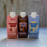 QNT protein shakes in Belgian Chocolate, Vanilla Ice Cream and Strawberry